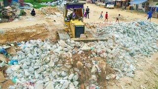 Starting a New Project Clearing Trash Adding Stones Soil Landfilling Up by 5ton Trucks With a Dozer