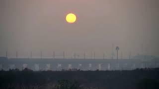 Trains Cross Paths As The Sun Rises In Background (4K UHD Footage)