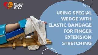 Demonstrating the Use of a Special Wedge with Elastic Bandage for Finger Extension Stretching