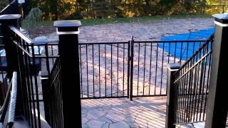 Fantastic 3 level deck Black Galaxy granite bar with custom Iron Rails by DeckRemodelers.com