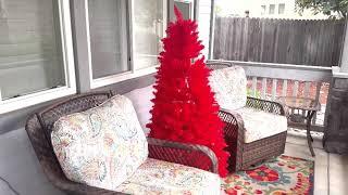 Festive Fun Unveiled: Red Christmas Tree for a Unique Porch Display ️