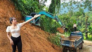 the girl and the driver excavator driving and trucks Land was being diverted into houses.