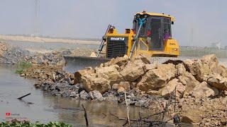 Show Wonderful Stronger Shantui Heavy Bulldozer Pushing Rocks In Water With Dump Truck Unloading