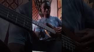 Ben Quint playing bass guitar at home. It's his world.