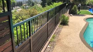 Amazing Pool Fence Design , Wrought iron with redwood .