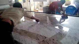 Applying epoxy - polymer to granite slab - India granite processing factory