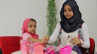 Maryam and Fatima are opening toyset from Zaky