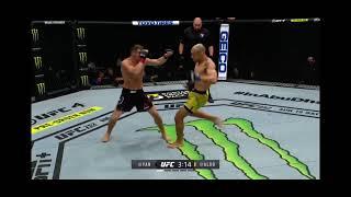 Jose Aldo drops Petr Yan with a leg kick