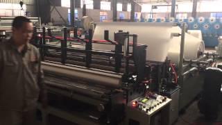 Coreless toilet paper roll rewinding machine