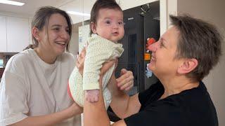 The grandmother's reaction to meeting her grandchild for the first time