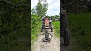 Tractor behind the statue