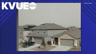 Wind damages roofs in Manor, Texas