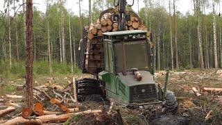 Logging with John Deere, wet forest conditions, big load