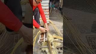 Bamboo weaving craftsmen are arranging bamboo strips