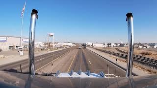 Straight piped Peterbilt rollin coal and Jake brakin