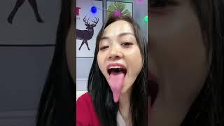 Hot chinese woman shows her long tongue and throat