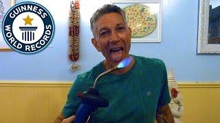 Most Blow Torches Extinguished With The Tongue - Guinness World Records