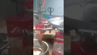 Automatic chili oil packaging machine with mixing function premade bags filler sealer