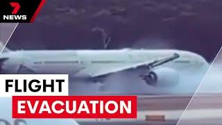 Etihad flight evacuation after wheels exploded before take-off | 7NEWS