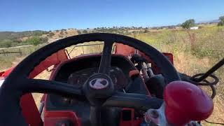 Tractor Mowing the Pastures