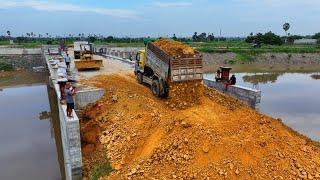 Start New Huge Construction Bridge Filling Space Us Soil Rock , Skill Bulldozer , Truck deliver soil