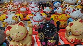 Traditional Maneki Neko lucky cat figurine on display | Hong Kong