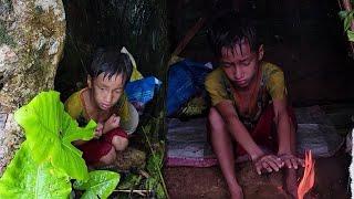 An orphan boy, without a home, went to the forest to camp in the heavy rain and was hungry and cold.