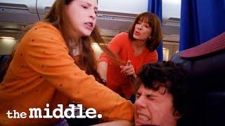 The Hecks Fight Over One First Class Seat | The Middle