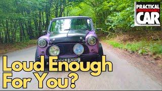 Twin carb fed Mini tears up the countryside. Loud, lairy - and very very purple? Most definitely.