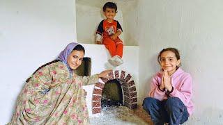 Building a shelter fireplace: The efforts of a master and nomadic girls