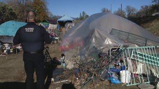 Police work to clear out and clean up homeless encampment north of Redding