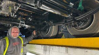 Underneath the low loader trailer / adding a light Machining bolts to make the sprayer work