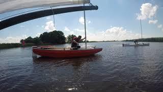 Viola 14 sailing canoe - hoisting the lug sail on the water