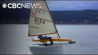 Holding fast to ice boat sailing on Williams Lake