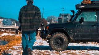 A man who spends a hard day in a winter night in an old camper van in Korea