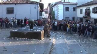 Man in Devil Costume getting pelted by turnips - Jarramplas 2010