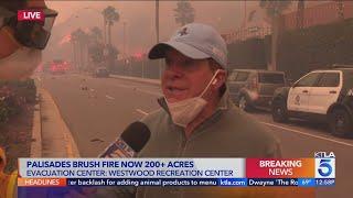 Actor Steve Guttenberg helping fire crews by moving cars near Pacific Palisades brush fire