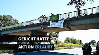 Klimaprotest legt Bremer Kreuz lahm: Aktivisten seilen sich von Brücke ab