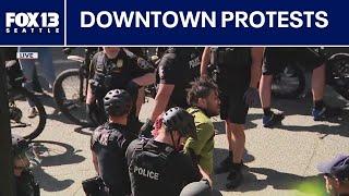 Seattle protesters square off outside City Hall