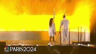 The Olympic Cauldron is lit at the 2024 Paris Olympics Opening Ceremony | NBC Sports