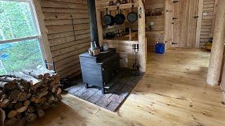 Log Cabin built in the North, got the wood stove ready, wood inside the Cabin,