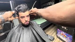 Ambidextrous barber cutting at the Barbershop “inviting barbers and customers to join him”