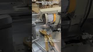 Automatic stringing machine for price tags