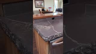 Concrete countertops: Rock edge molding, integrated drain board and cutting board.