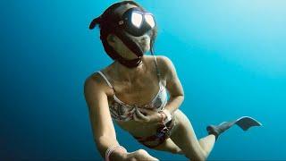 Freediving Girl Exploring the Sea at Maldives 