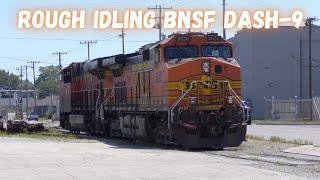 A ROUGH idling BNSF dash-9 sits as it waits for a grain train to be loaded