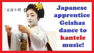 Japanese apprentice Geishas (Maiko) dance to kantele music in Kyoto