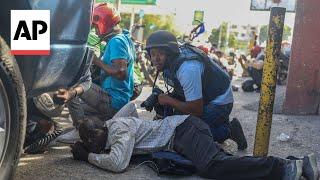 Shootouts break out between police and gangs as Haiti swears in prime minister