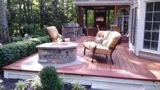 This looks more like wood than wood! Deck Designs. Beautiful Zuri Deck with fire place and kitchen