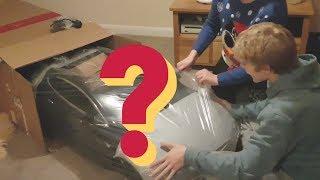 TESLA SENT US A CHRISTMAS PRESENT! | MINI TESLA MODEL S UNBOXING